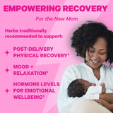 A woman smiling down at her baby. Empowering recovery for the new mom. 