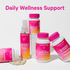 Group of Pink Stork general wellness products standing next to and leaning against each other. Daily wellness support.