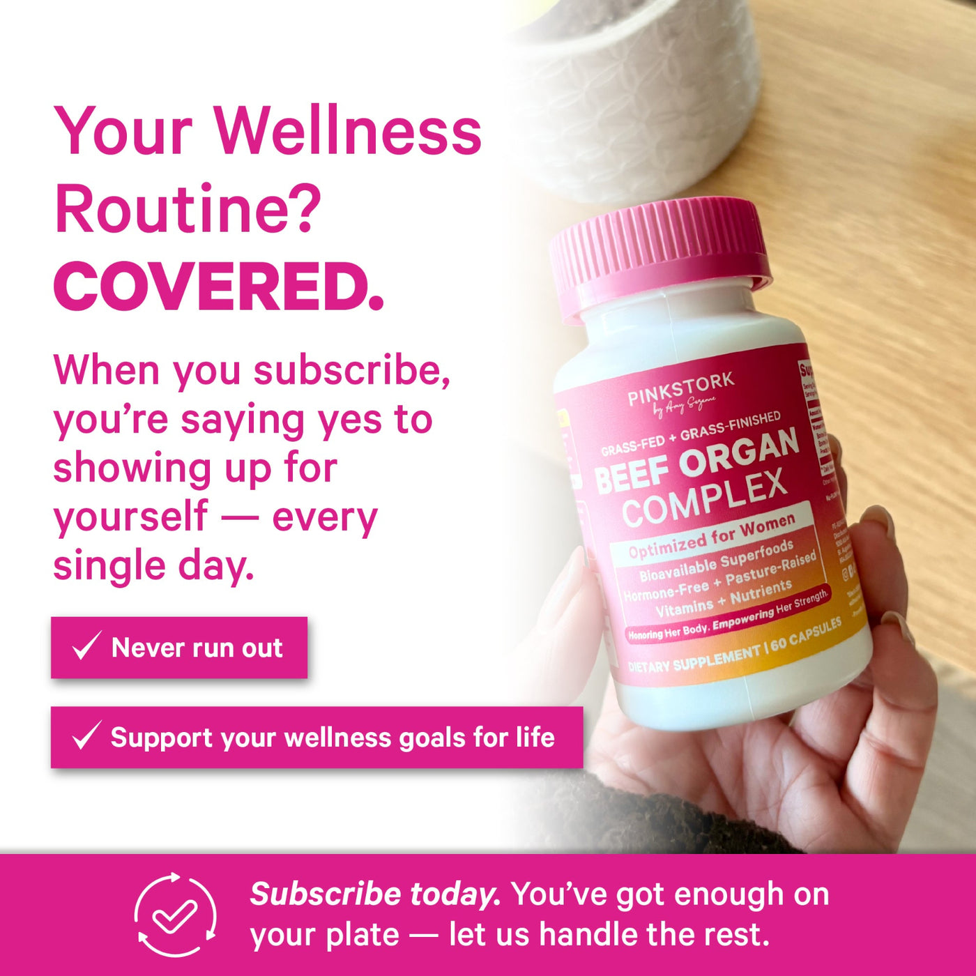 A hand holding a bottle of Pink Stork Nutrition Beef Organ Complex dietary supplement, set against a bright, clean background with promotional text about wellness subscription coverage.