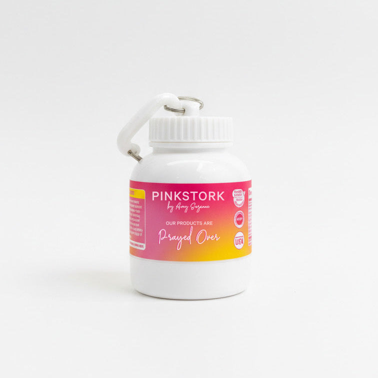 White container with a pink label on a white background