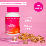 Pink Stork DHA sitting on two thin prisms with DHA gel capsules surrounding the bottom of the bottle. Clinically studied Omega 3s. From sustainably sourced fish.