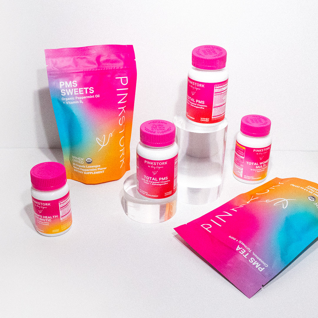 Group of Pink Stork products standing on clear prisms.