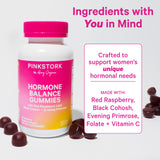 Bottle of Pink Stork Hormone Balance Gummies with gummies surrounding the bottle. Ingredients with YOU in mind.