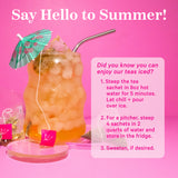 Cup of iced tea with mini umbrella and straw coming out of it. Say hello to summer! Instructions on how to make Pink Stork teas iced.