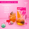 Pink Stork Labor Prep tea bag with tea in iced cup and steeping in a mug with raspberries next to it. Naturally prepare for labor with list of ingredients. USDA Organic.