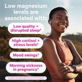 African American woman smiling with her arms crossed in front of a mountain. Low Magnesium levels are associated with low quality + disrupted sleep, high cortisol + stress levels, and more.