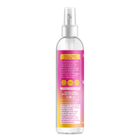 Clear spray bottle with gradient label on a white background