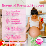 Pregnant woman looking down at her baby bump while eating watermelon in the kitchen. Essential prenatal support with a list of benefits this product provides. USDA organic.