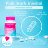 Pink Stork Myo/Chiro 3.6:1 on a clear prism with a glass circular plate standing up behind it with capsules spread around it. Pink Stork Inositol for hormone balance.