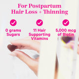 Hand holding a heart shaped gummy with prism effect on it. For postpartum hair loss + thinning.