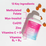 Pink Stork Premium Fertility Gummies bottle laying surrounded by gummies. 13 key ingredients.