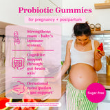 Women looking down at her pregnant belly while holding a slice of watermelon. Probiotic Gummies for pregnancy + postpartum. Strengthens mom + baby's immune system. Cognitive support through gut-brain axis. Occasional constipation + gas support. Sugar-free.