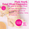 Ginger root and turmeric powder on white wood table. Pink Stork Total Bloat Gummies - we put it to the test.