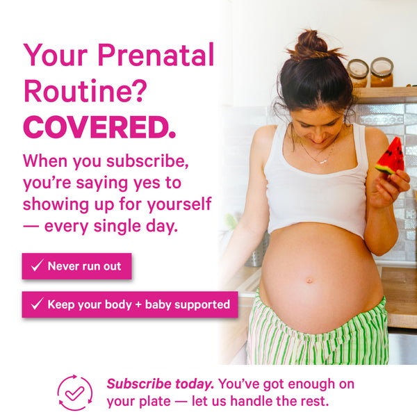 Pregnant woman holding fruit in kitchen representing daily prenatal wellness routine and nutrition support.
