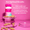 Pink Stork Postpartum Probiotic on stack of clear prisms with capsules surrounding the bottle. For optimal results - pair with our Postnatal Probiotic.