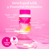 Pink Stork Women's Health Probiotic bottle stacked on clear prisms with capsules surrounding the bottle. Developed with 5 powerful probiotics. 1 capsule daily.